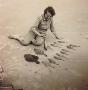 Visserman op strand